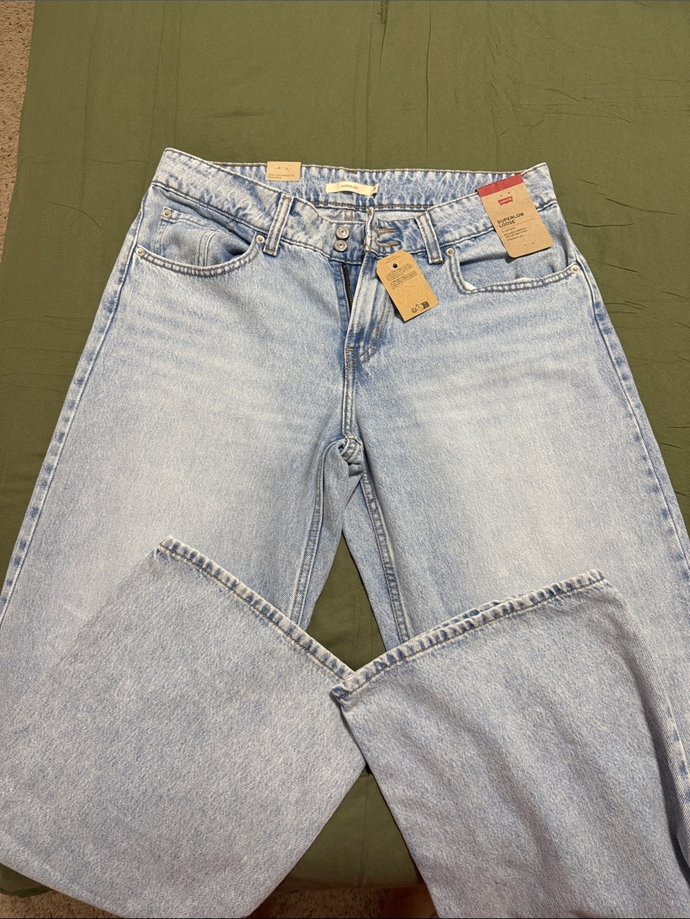 Levis light blue superlow women’s jeans.